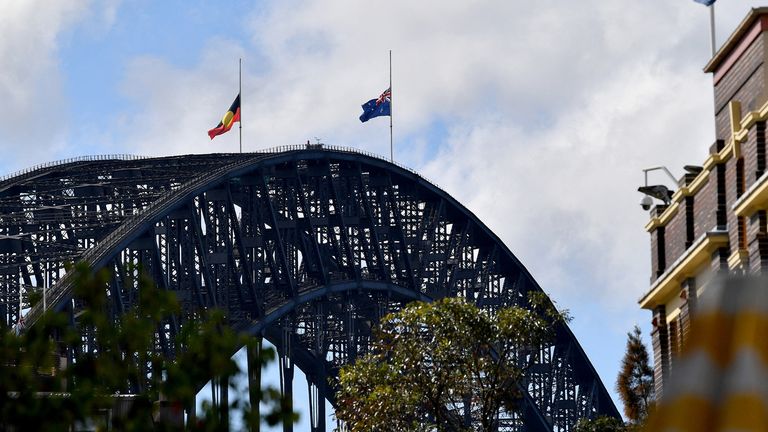 Flags are flown half-mast on the Sydney Harbour Bridge
