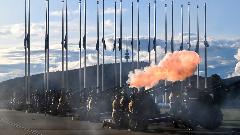 Australian Defense Force fire M2A2 105mm howitzer ceremonial guns for a 96-gun salute outside Parliament House in Canberra, Australia. Pic: AP