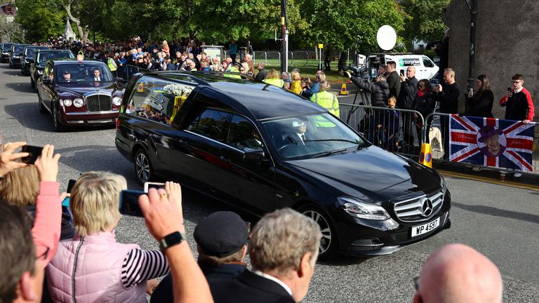 The hearse carrying the coffin of Britain&#39;s Queen Elizabeth passes through the village of Ballater, near Balmoral, Scotland, Britain, September 11, 2022. REUTERS/Kai Pfaffenbach
