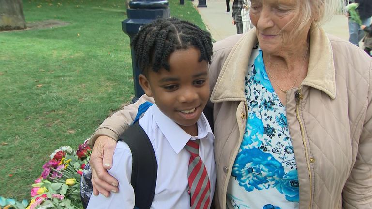 A boy and his great-grandmother pay tribute to the Queen in Birmingham