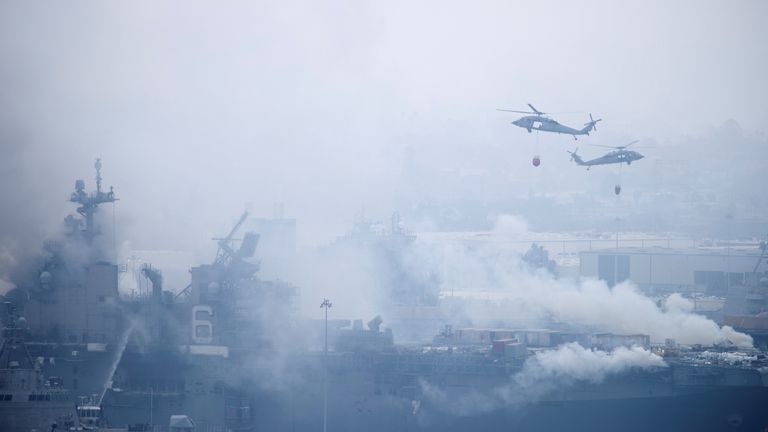 U.S. Navy helicopters and city firefighters continue to fight fires aboard the amphibious assault ship USS Bonhomme Richard at Naval Base San Diego, in San Diego, California, U.S. July 13, 2020. REUTERS / Mike Blake