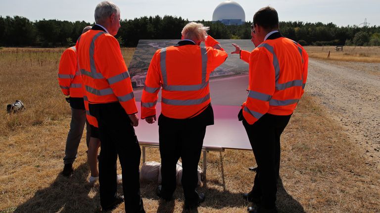 Prime Minister Boris Johnson (centre) looks at plans for the Sizewell C nuclear power station project, during his visit to EDF&#39;s Sizewell B Nuclear power station in Suffolk. Picture date: Thursday September 1, 2022.
