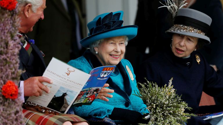Britain&#39;s Queen Elizabeth, together with her son Prince Charles and her daughter Princess Anne react as they watch an event at the Braemar Highland Gathering in Braemar, Scotland, Britain, September 1, 2018. REUTERS/Russell Cheyne