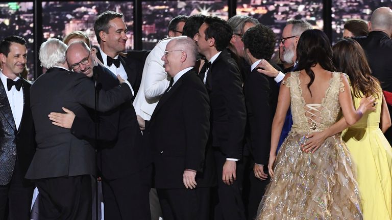 Brian Cox and Jesse Armstrong (left) hug as the team from Succession accepts the Emmy for outstanding drama series