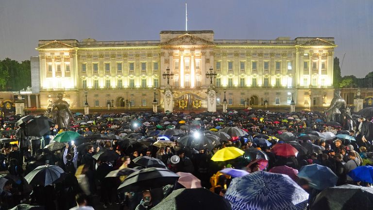 People gather outside the gates of the Buckingham Palace in London, following the death of Queen Elizabeth II. Picture date: Thursday September 8, 2022.

