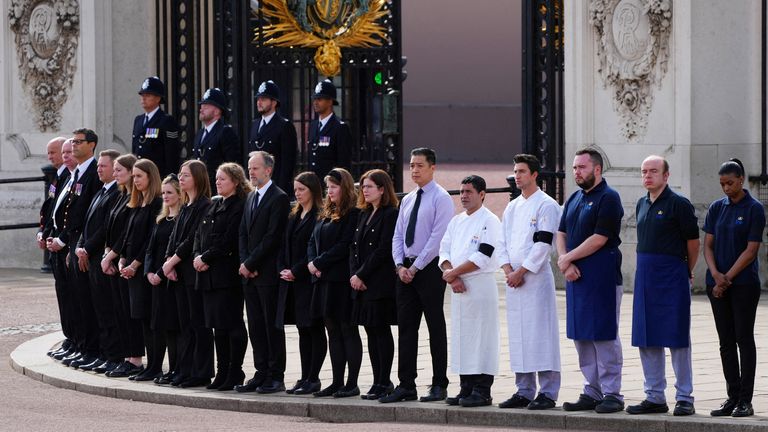 Buckingham Palace household staff pay their respects during the State Funeral of Queen Elizabeth II on September 19, 2022 in London