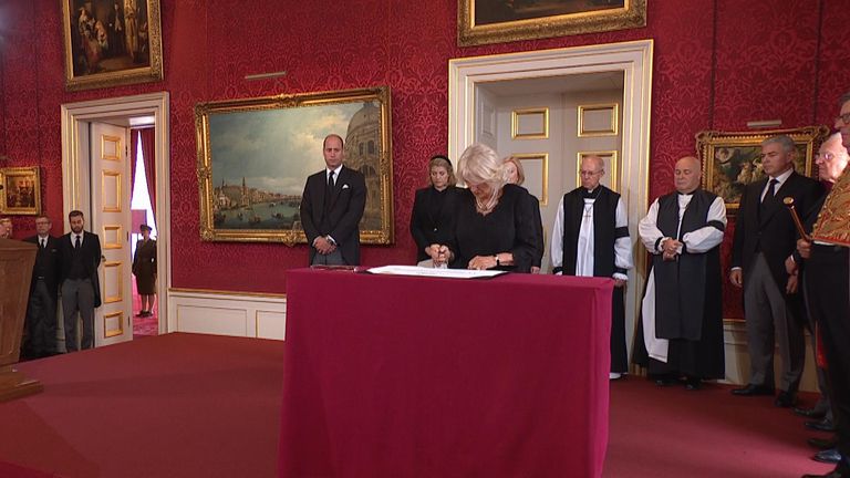 Camilla  signs to declaration 
