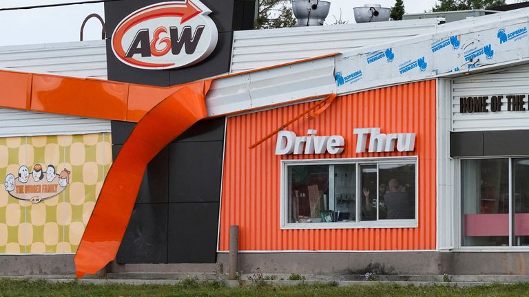 The banner of A&W restaurant dangles in wind after the arrival of Hurricane Fiona in Stephenville, Newfoundland, Canada September 24, 2022. REUTERS/John Morris