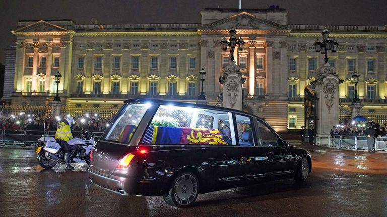 The hearse carrying the coffin of Queen Elizabeth II arrives at Buckingham Palace, London, where she will rest overnight in the Bow Room.  Photo date: Tuesday, September 13, 2022.