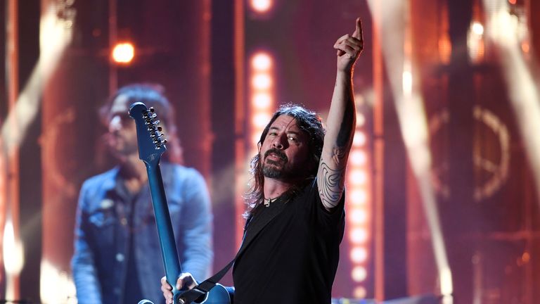 Dave Grohl of the Foo Fighters performs after the band was inducted into the Rock and Roll Hall of Fame, in Cleveland, Ohio, U.S. October 30, 2021. REUTERS/Gaelen Morse