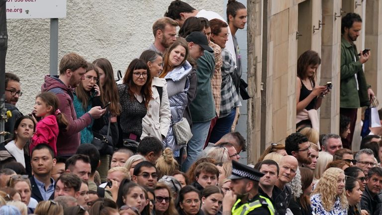 People in Cannongate, Edinburgh ahead of the passing of Queen Elizabeth II&#39;s coffin on its journey from Balmoral to Edinburgh, where it will lie at rest at the Palace of Holyroodhouse. Picture date: Sunday September 11, 2022.

