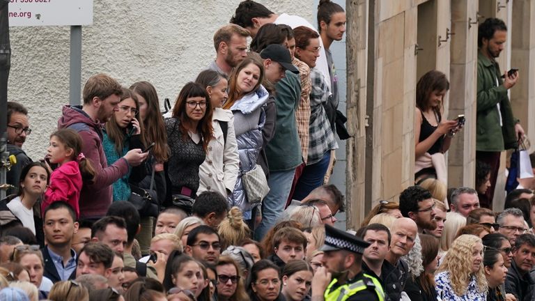 People in Cannongate, Edinburgh ahead of the passing of Queen Elizabeth II&#39;s coffin on its journey from Balmoral to Edinburgh, where it will lie at rest at the Palace of Holyroodhouse. Picture date: Sunday September 11, 2022.

