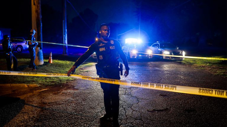 Memphis police officers search an area where a body had been found in South Memphis, Tenn., near Victor Street and East Person Ave., Monday, Sept. 5, 2022. Police in Tennessee said Tuesday, Sept. 6, they had found the body of a Memphis woman abducted during a pre-dawn run, confirming fears that Eliza Fletcher was killed after she was forced into an SUV on Friday morning. Cleotha Abston has been charged with kidnapping and murder in the case. (Mark Weber/Daily Memphian via AP)