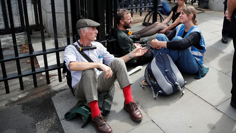 Extinction Rebellion protesters sit at the gates of the Houses of Parliament in London, Britain September 2, 2022. REUTERS/Peter Nicholls
