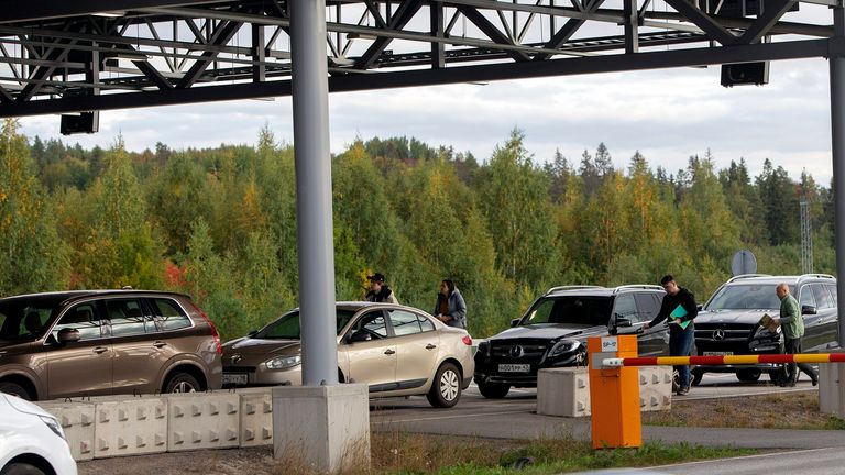 Cars queue to cross the border from Russia to Finland at the Nuijamaa border check point in Lappeenranta, Finland, Thursday, Sept. 22, 2022. (Lauri Heino/Lehtikuva via AP)