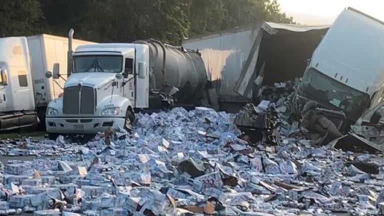 A Florida highway had to temporarily close after a semi-trailer carrying cases of Coors Light crashed. Pic: Florida Highway Patrol