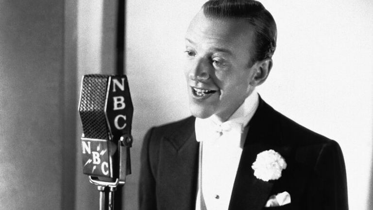 American dancer and film star Fred Astaire seen broadcasting on the American radio in November 1941. (AP Photo)


