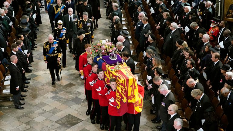 King Charles III, Camilla, the Queen Consort, Princess Anne, Vice Admiral Sir Tim Laurence, Prince Andrew, Prince Edward,  Sophie, the Countess of Wessex, Prince William, Kate, the Princess of Wales, Prince George and  Princess Charlotte follow behind the coffin of Queen Elizabeth II, draped in the Royal Standard with the Imperial State Crown and the Sovereign&#39;s orb and sceptre,  as it is carried out of Westminster Abbey after her State Funeral, in London, Monday Sept. 19, 2022. The Queen, who died aged 96 on Sept. 8, will be buried at Windsor alongside her late husband, Prince Philip, who died last year. (Danny Lawson/Pool Photo via AP)