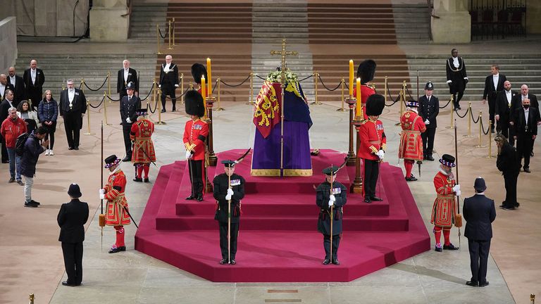 At 06:28am on the day of her funeral the final members of the public pay their respects at the coffin of Queen Elizabeth II, draped in the Royal Standard with the Imperial State Crown and the Sovereign&#39;s orb and sceptre, lying in state on the catafalque in Westminster Hall, at the Palace of Westminster, London. Picture date: Monday September 19, 2022.