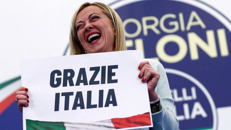 Leader of Brothers of Italy Giorgia Meloni holds a sign at the party&#39;s election night headquarters, in Rome, Italy September 26, 2022. 