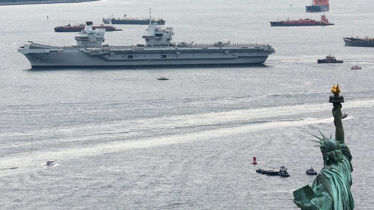 HMS Queen Elizabeth passing the Statue of Liberty as she arrives in New York