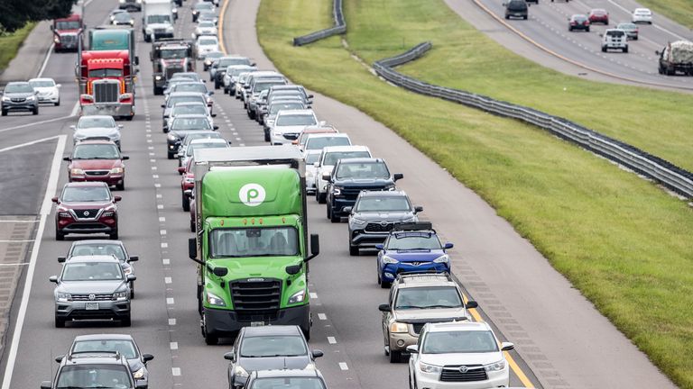 Traffic builds along Interstate 4 in Tampa, Fla., Tuesday, Sept. 27, 2022, as Hurricane Ian approaches. (Willie J. Allen Jr./Orlando Sentinel via AP)