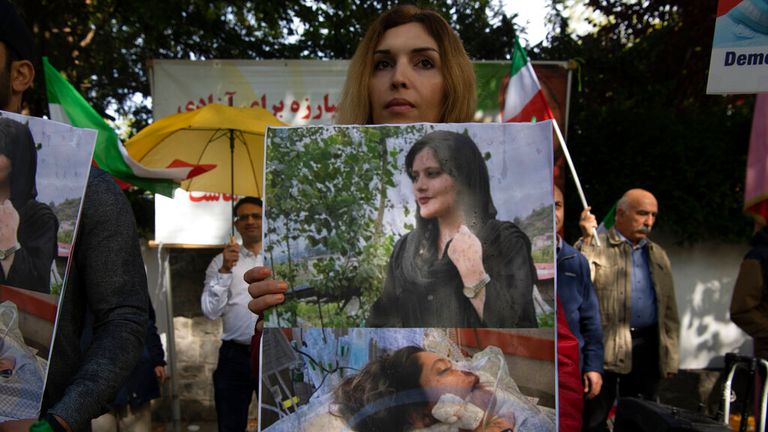 A protester outside the Iranian Embassy in Berlin Photo: AP 