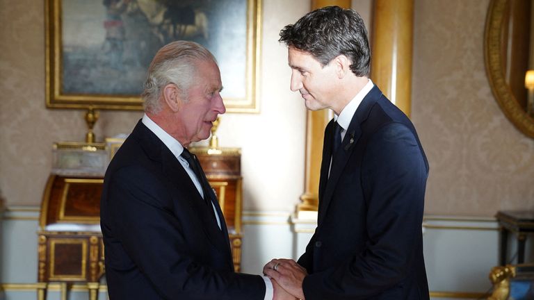 King Charles III shakes hands with Prime Minister of Canada, Justin Trudeau, as he receives realm prime ministers in the 1844 Room at Buckingham Palace in London. Picture date: Saturday September 17, 2022. Stefan Rousseau/Pool via REUTERS