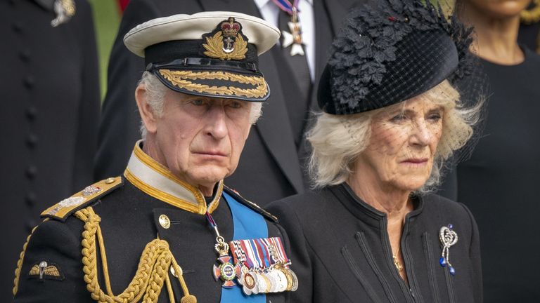 King Charles III and the Queen Consort look on as the State Gun Carriage carrying the coffin of Queen Elizabeth II arrives at Wellington Arch during the Ceremonial Procession following her State Funeral at Westminster Abbey, London.