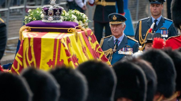 King Charles III (centre) and the Prince of Wales (right) follow the coffin of Queen Elizabeth II, draped in the Royal Standard with the Imperial State Crown placed on top, carried on a horse-drawn gun carriage of the King&#39;s Troop Royal Horse Artillery, during the ceremonial procession from Buckingham Palace to Westminster Hall, London, where it will lie in state ahead of her funeral on Monday. Picture date: Wednesday September 14, 2022.

