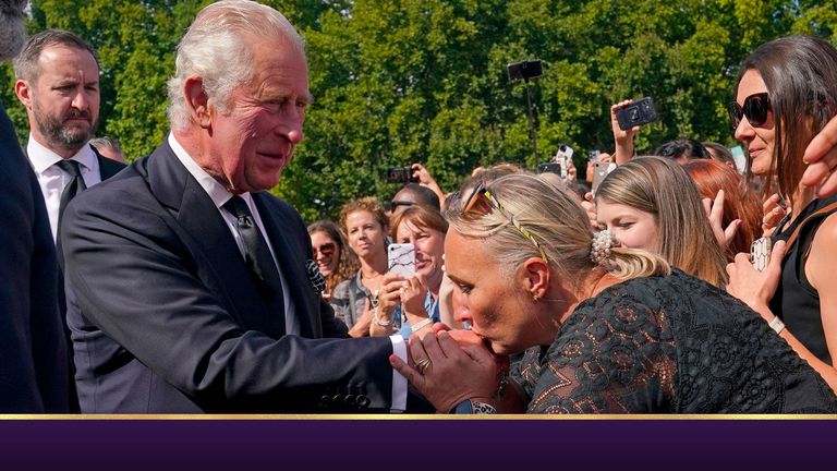A well-wisher kisses the hand of King Charles III during a walkabout outside Buckingham Palace, London, to view messages and tributes following the death of Queen Elizabeth II on Thursday. Picture date: Friday September 9, 2022.
