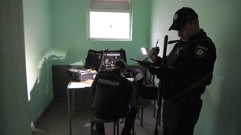 Investigators gather DNA evidence in the police station&#39;s interrogation room  