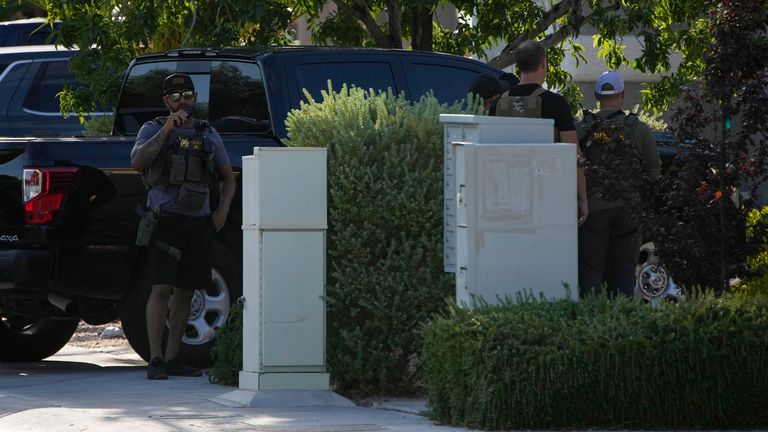 Police outside Robert Telles&#39; home on Wednesday. Pic: AP