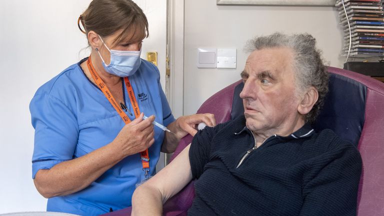 Registered Nurse Laura Hastings administers a covid booster to Andrew Young, 72, at Victoria Manor Care home in Edinburgh to launch the winter vaccine programme. Picture date: Monday September 5, 2022.
