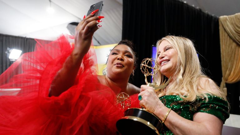 Lizzo, winner of the Emmy for outstanding competition program for "Lizzo's Watch Out For The Big Grrrls" poses with Jennifer Coolidge, the winner of the Emmy for outstanding supporting actress in a limited or anthology series or movie for "The White Lotus" at the 74th Emmy Awards on Monday, Sept. 12, 2022 at the Event Deck at L.A. LIVE in Los Angeles. (Photo by Danny Moloshok/Invision for the Television Academy/AP Images)
