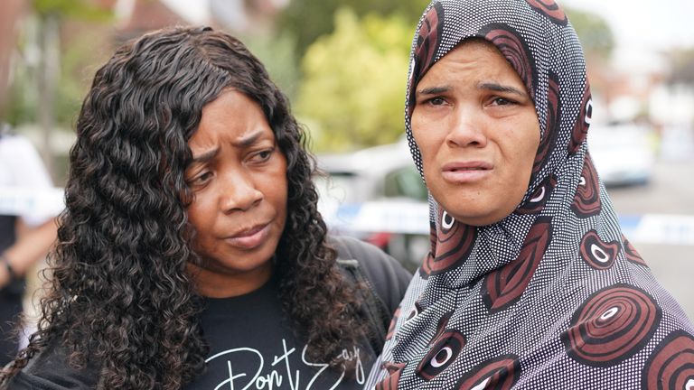 (left-right) Pastoress Lorraine Jones with Kimberly Alleyne, 49, who said she is the mother-in-law to be of the deceased, speaks to the media at the scene in Kirkstall Gardens, Streatham Hill, south London. A man was shot by armed officers from the Metropolitan Police following a pursuit on Monday evening. The man, believed to be in his 20s, has died in hospital. Picture date: Tuesday September 6, 2022.
