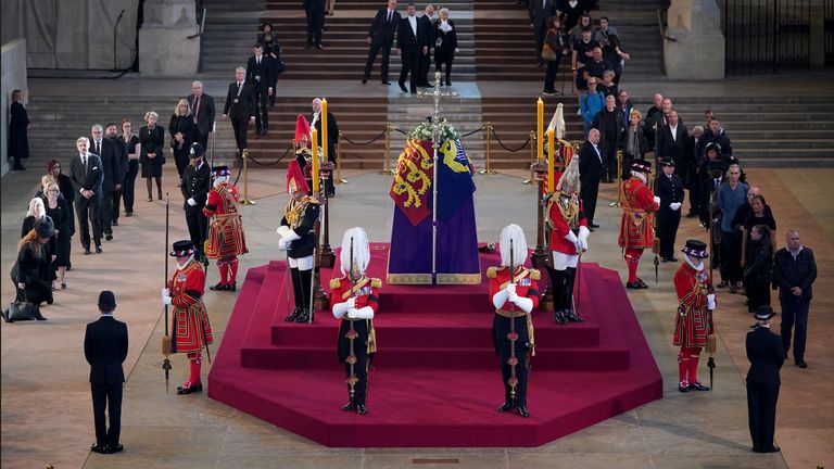 The first members of the public pay their respects as the vigil begins around the coffin of Queen Elizabeth II at Westminster Hall, London