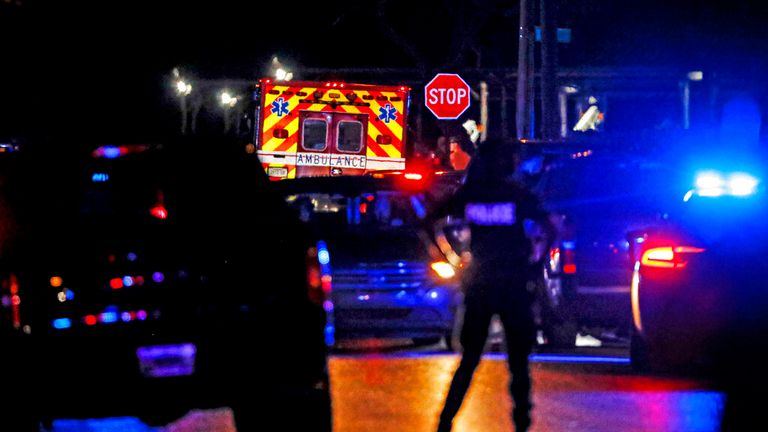 Police at one crime scene in Poplar Avenue, Memphis Pic: AP 