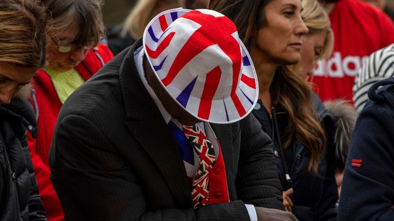 Many of those who gathered in the capital wore mourning outfits with a patriotic twist. Pic: AP