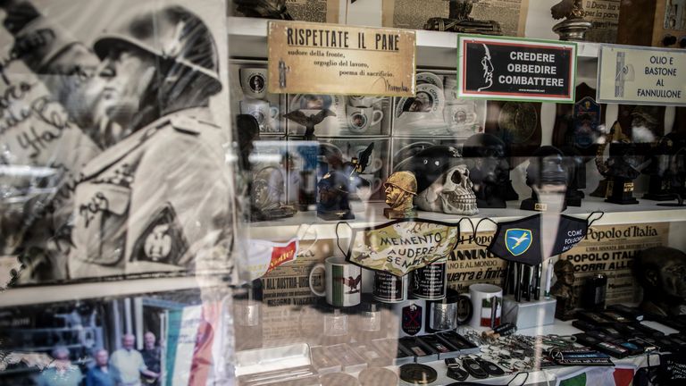 Devotional objects of the former Italian dictator Benito Mussolini and fan articles of fascism are sold in a store in Predappio, where Mussolini is buried. Pic: AP