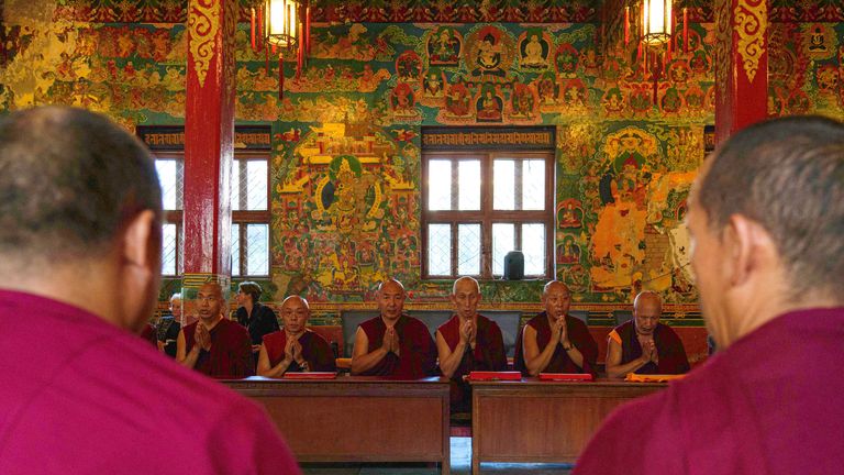 Buddhist monks participate in a prayer session to mark the funeral of Britain&#39;s Queen Elizabeth II at a Buddhist monastery in Kathmandu, Nepal, Monday, Sept. 19, 2022. (AP Photo/Niranjan Shrestha)