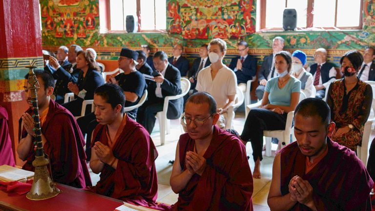 People participate in a prayer session to mark the funeral of Britain&#39;s Queen Elizabeth II at a Buddhist monastery in Kathmandu, Nepal, Monday, Sept. 19, 2022. (AP Photo/Niranjan Shrestha)