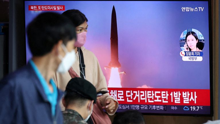 People in Seoul in South Korea watch a report on the missile test