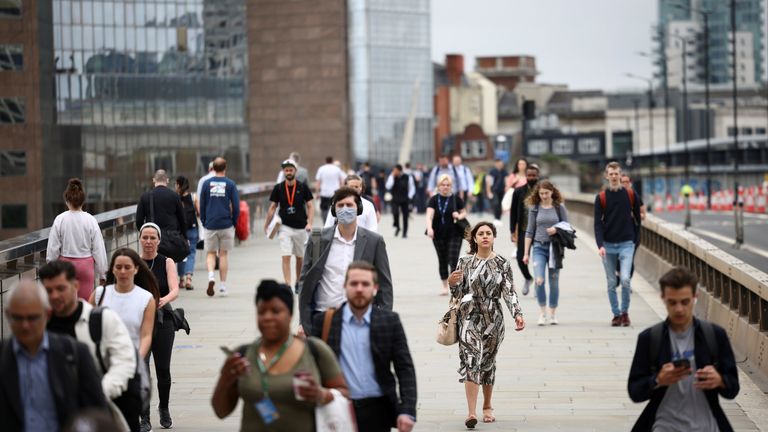 People walk across London Bridge during morning rush hour, in London, Britain, June 11, 2021. REUTERS/Henry Nicholls
