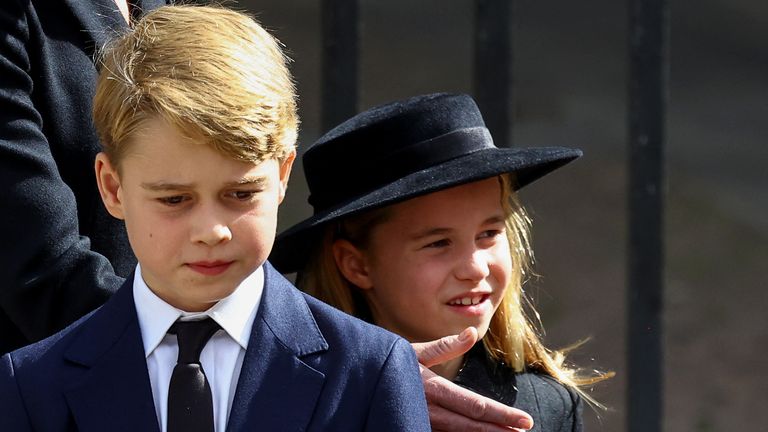 Britain's Prince George and Princess Charlotte walk after a service at Westminster Abbey on the day of the state funeral and burial of Britain's Queen Elizabeth, in London, Britain, September 19, 2022. REUTERS/Hannah McKay/Pool