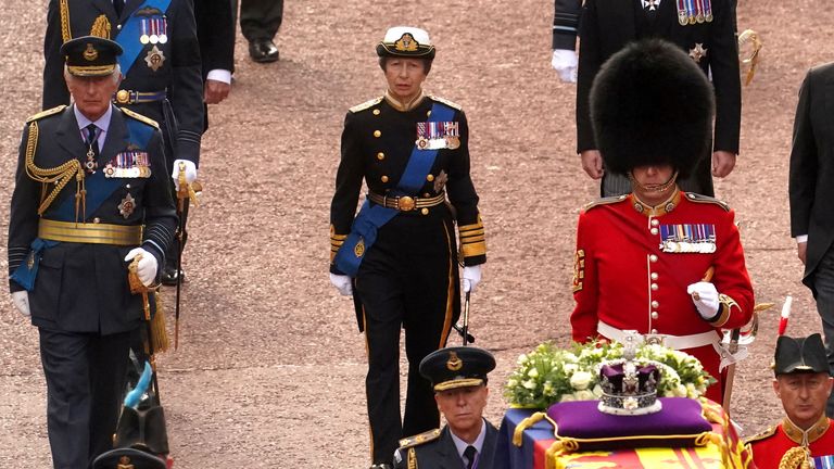 Britain&#39;s King Charles III, Anne, Princess Royal, William, Prince of Wales, Prince Andrew, Prince Edward, Prince Harry, and Peter Phillips follow the coffin of Queen Elizabeth II, draped in the Royal Standard with the Imperial State Crown placed on top, as it is carried on a horse-drawn gun carriage of the King&#39;s Troop Royal Horse Artillery, during the ceremonial procession from Buckingham Palace to Westminster Hall, London, where it will lie in state ahead of her funeral on Monday. Picture date