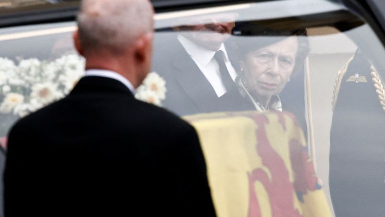 The Princess Royal approaches the hearse carrying the coffin of Queen Elizabeth II, draped with the Royal Standard of Scotland, as it arrives at Holyroodhouse, Edinburgh, where it will lie in rest for a day. Picture date: Sunday September 11, 2022.
