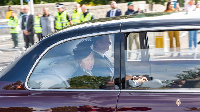 The Princess Royal and her husband Admiral Sir Tim Laurence travel behind the hearse carrying the coffin of Queen Elizabeth II as the procession passes through Aberdeen