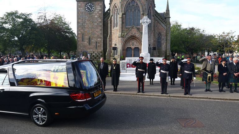 The hearse carrying the coffin of Britain&#39;s Queen Elizabeth passes through the village of Ballater, near Balmoral, Scotland, Britain, September 11, 2022. REUTERS/Hannah McKay
