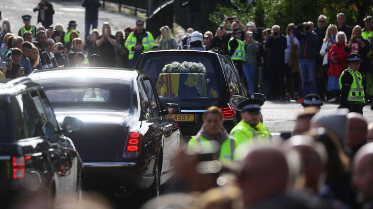 The hearse carrying the coffin of Britain&#39;s Queen Elizabeth passes through the village of Ballater, near Balmoral, Scotland, Britain, September 11, 2022. REUTERS/Kai Pfaffenbach
